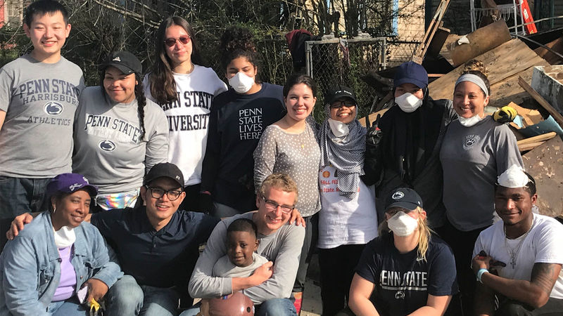 Penn State students take a group photo with local residents from Beaumont Texas.