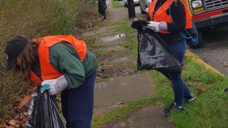 students helping to clean up streets