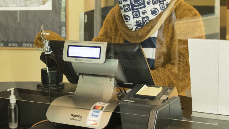 Nittany Lion swiping out hunger at the register in the dining commons