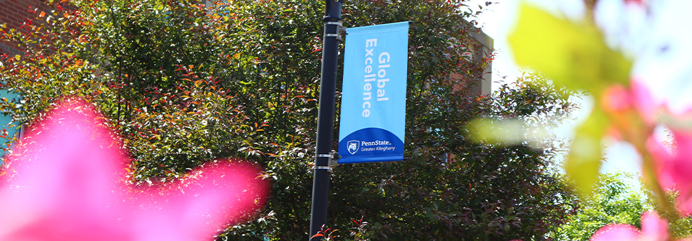 Banner at Greater Allegheny that reads "Global Excellence"