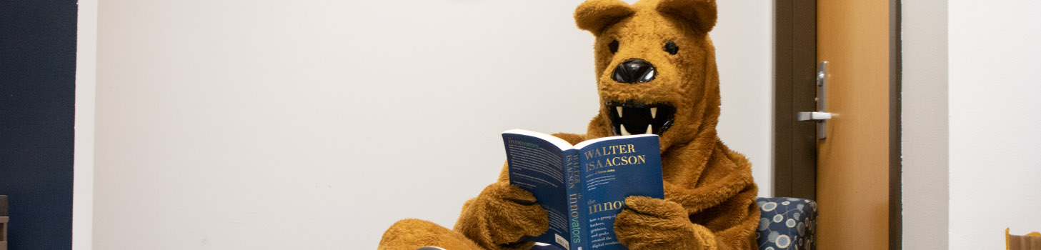 Penn State Mascot reading a book