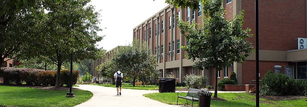 boy walking on campus