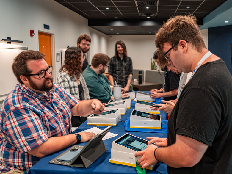 students getting an iPad from IT services