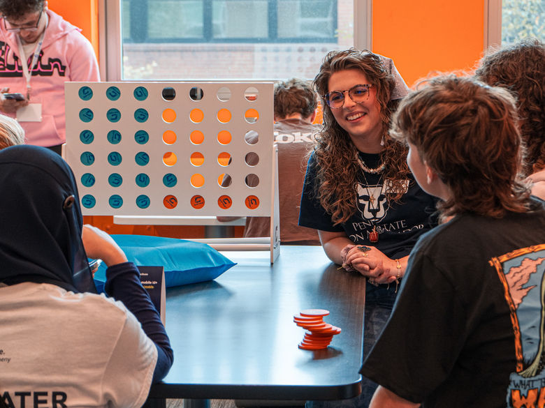 Students in a lounge playing games