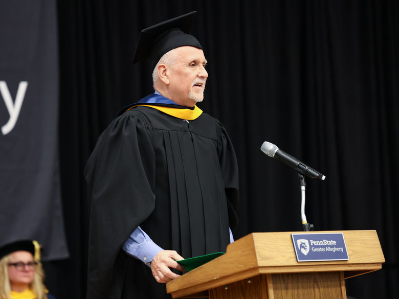 faculty member speaking at a podium