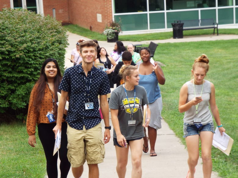 Students walking up walkway.
