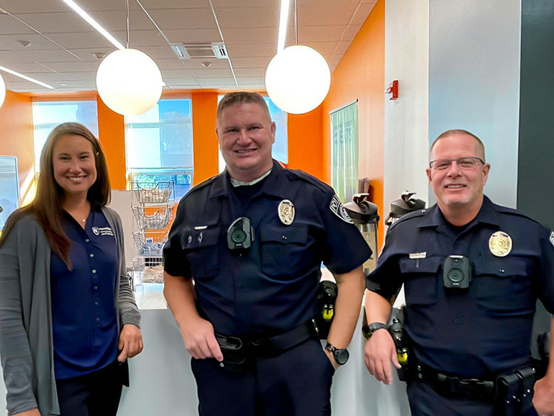 3 university police and public safety officers visiting the second floor frable building lounge to engage with students.