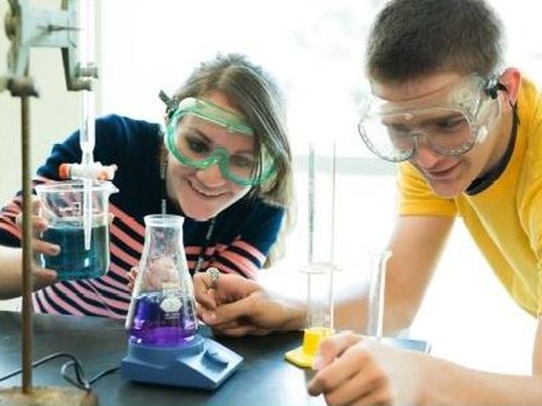 Two students working in a laboratory.