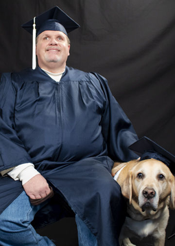 Jerry Pastories and Service Dog Nittany getting graduation photo taken