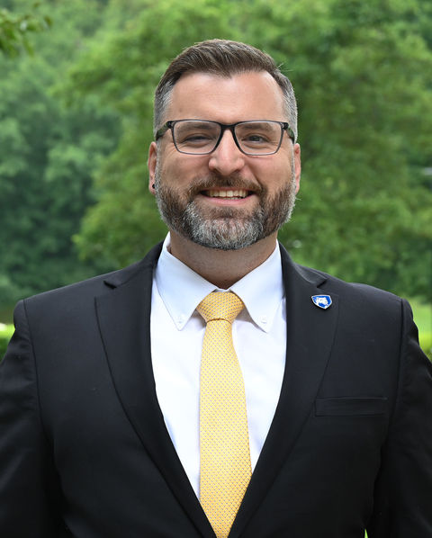 Man wearing a suit smiling