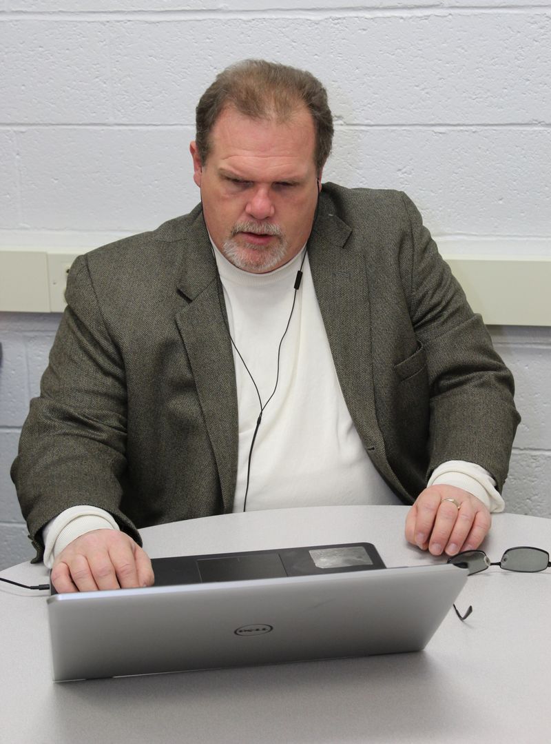 Jerry Pastories listening to screen reader on his laptop computer