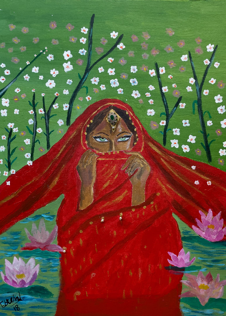 Indian women in front of trees and flowers