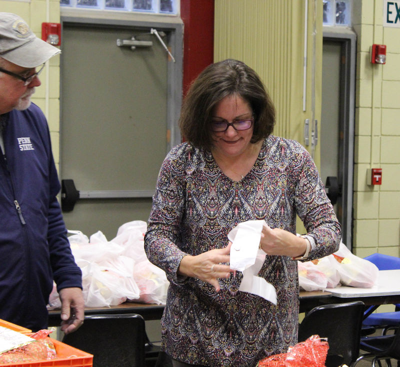 Chancellor Jacqueline Edmondson helping package meals. 