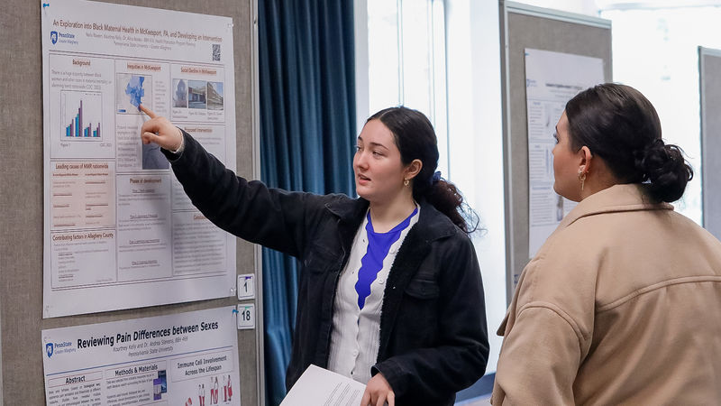 Student presents poster at Research Conference.