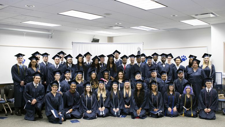 Penn State Greater Allegheny Class of 2018 Graduates wearing their caps and gowns