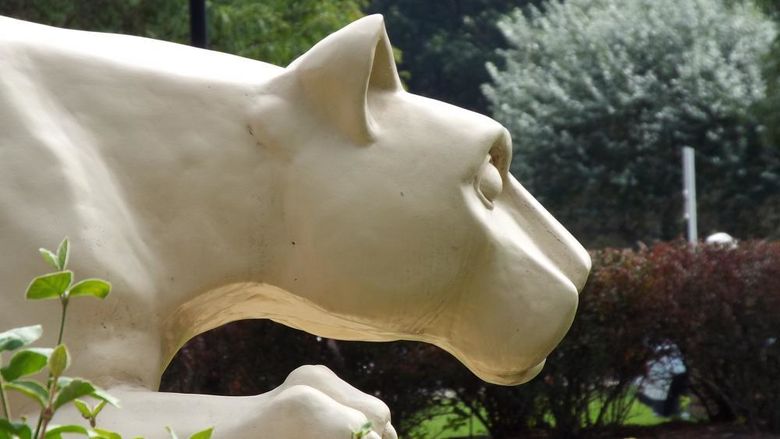 Side view of a Nittany Lion statue