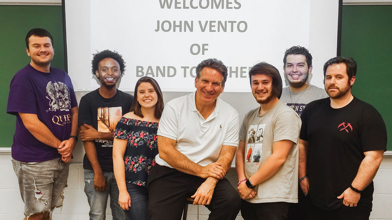Penn State Greater Allegheny communications students pose with John Vento, founder of Pittsburgh’s Band Together. 