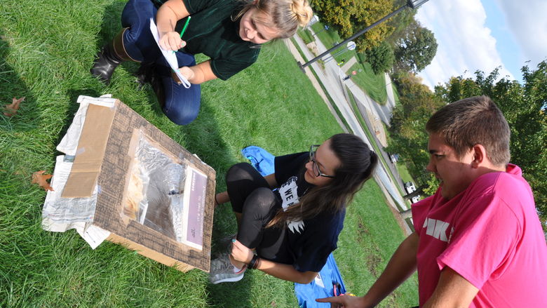 students looking at Pizza Box ovens