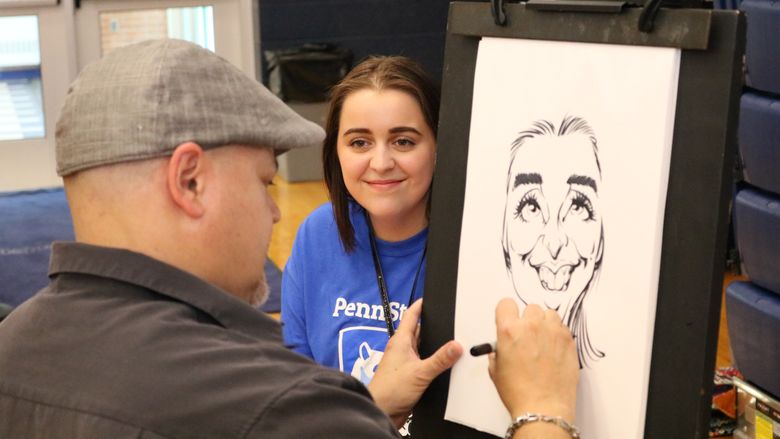 Cartoon artist drawing an portrait of a student. 