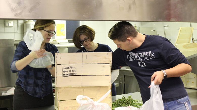 Employees packing food into bags