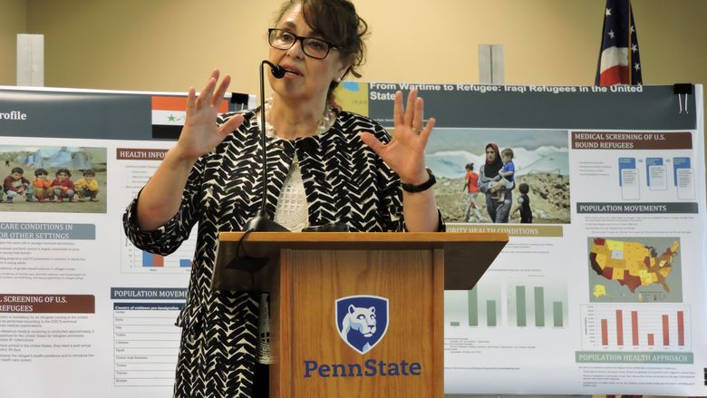 Verónica Montecinos speaking at a podium