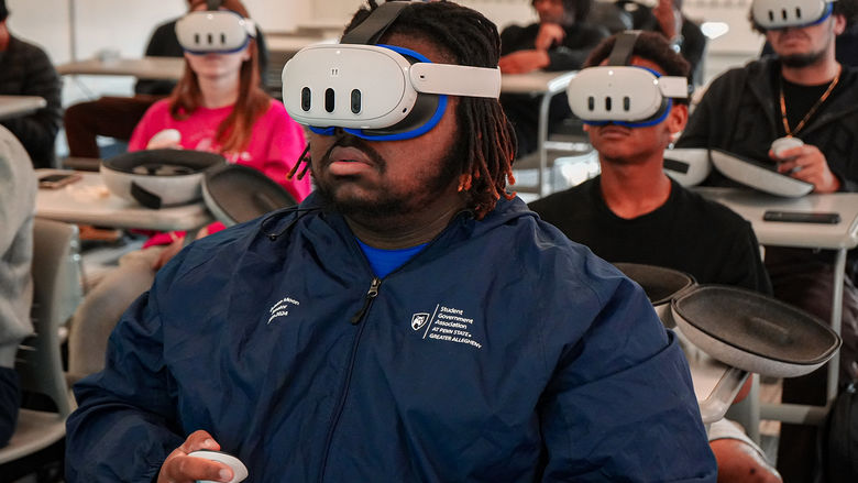 Student using a Meta Quest 3 headset in class