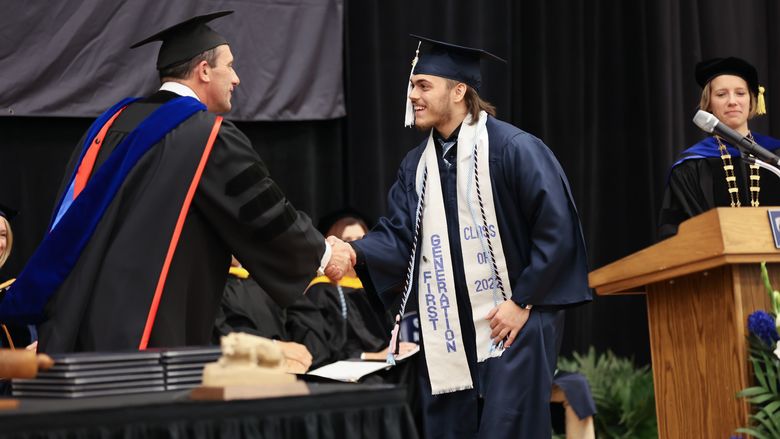Student Marshal and Information Sciences and Technology (B.S.) Degree Candidate, Nicholas Anthony Trunzo accepting an Academic Excellence Award