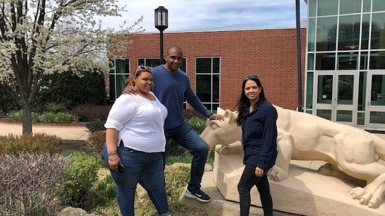 Photo of Short family at lion shrine at Greater Allegheny