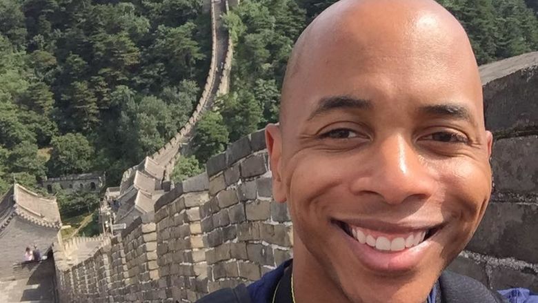 man in front of great wall