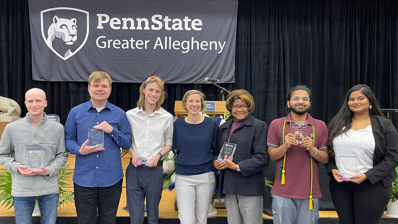 people holding awards and smiling