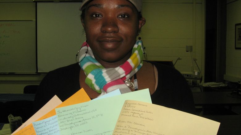 woman holding letters