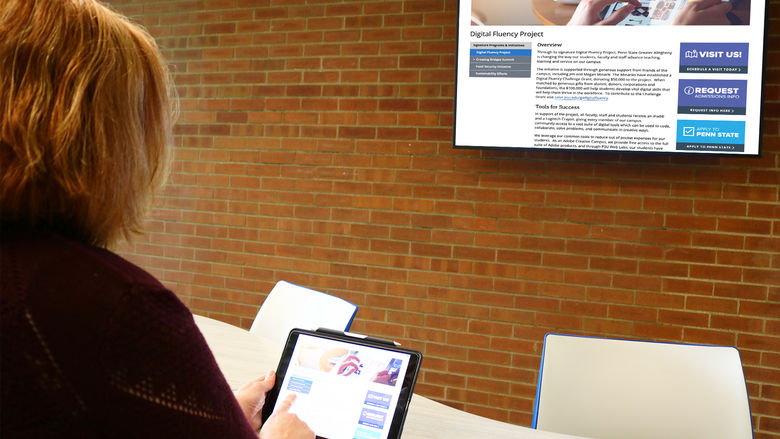 Dr. Kristal Tucker streaming her iPad to a TV in a collaborative common area in Ostermayer Laboratory