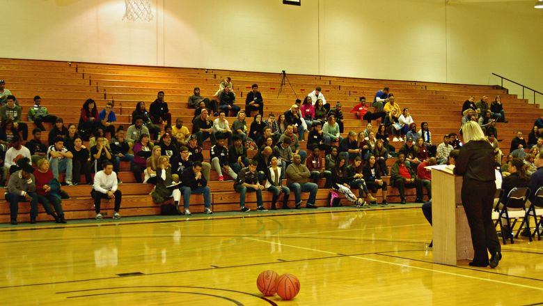 crowd sitting on bleachers