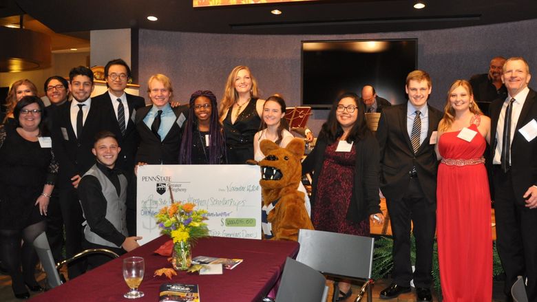 students with big check