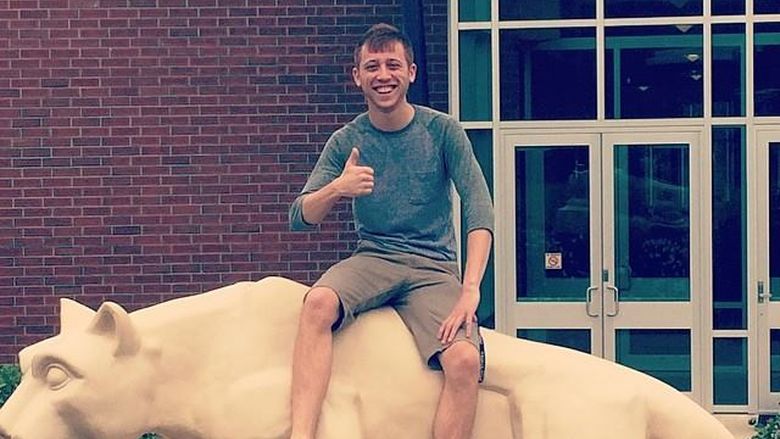 man sitting on lion statue