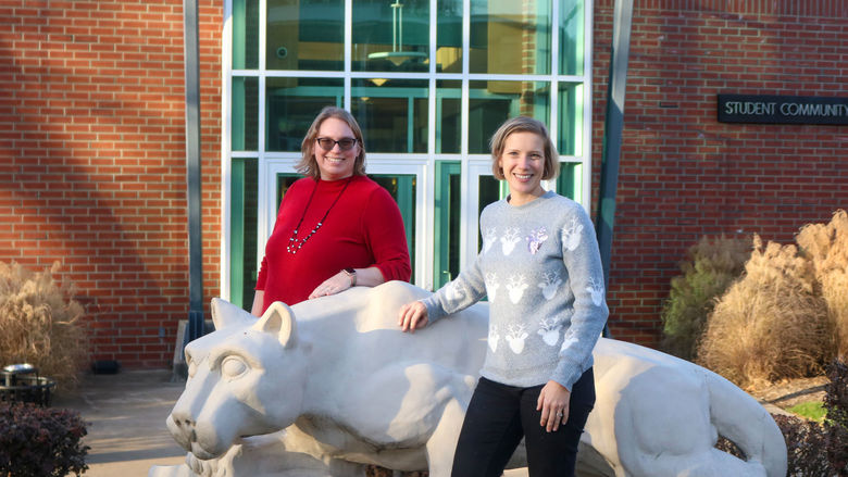 two women posing at the Greater Allegheny Lion Shrine
