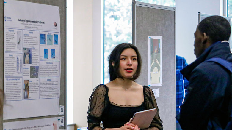 Student presents poster at Research Conference
