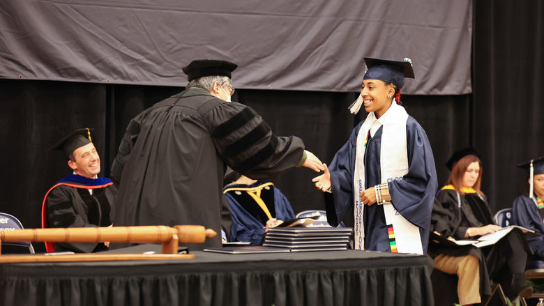 Business (B.S.) Degree Candidate, Ilana M. Ballard, receives her diploma