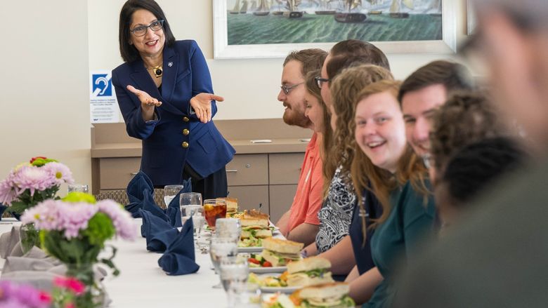 Penn State President-elect Neeli Bendapudi gestures while talking with student leaders at Penn State Behrend.