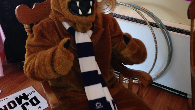 lion mascot in rocking chair