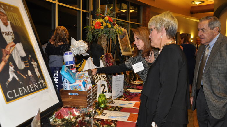 people looking at auction items