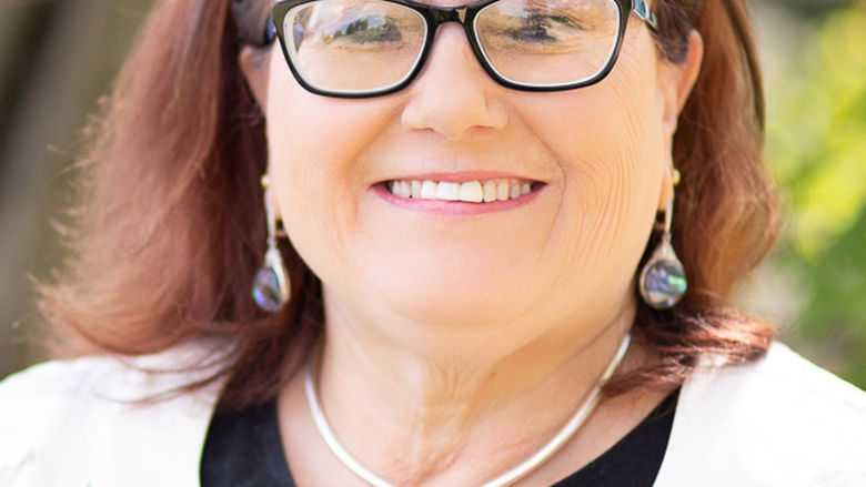 lady smiling wearing glasses 