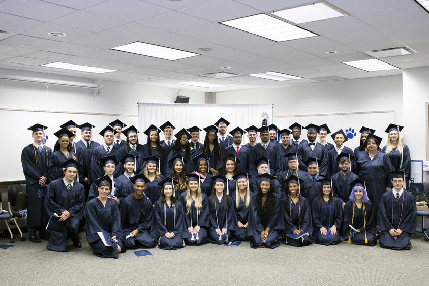 Penn State Greater Allegheny Class of 2018 Graduates wearing their caps and gowns