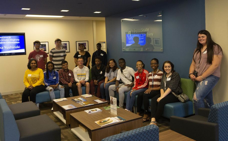 PaSSS Students sitting on furniture smiling 