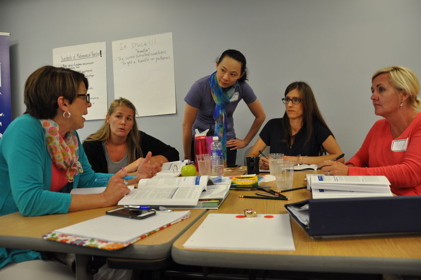 professor working with adult students