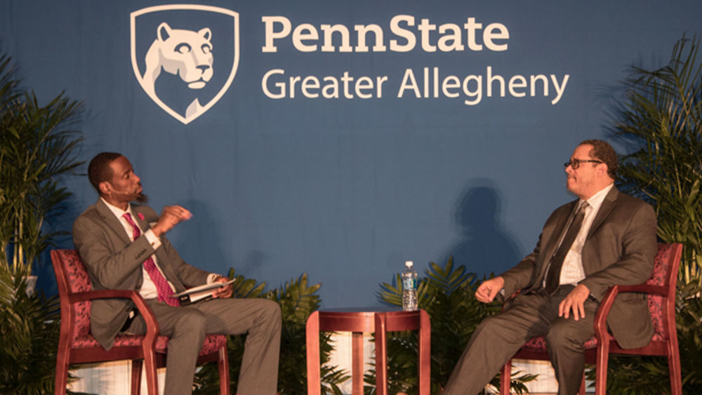 Johnathan White interviews Dr. Michael Eric Dyson on stage at Crossing Bridges: A Summit