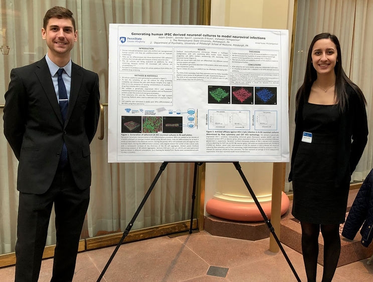 Students Adam Smith (Greater Allegheny) and Jennifer Naciri (University of Pittsburgh) standing next to their research at the Undergraduate Research at The Capitol Pennsylvania (URC-PA) event.