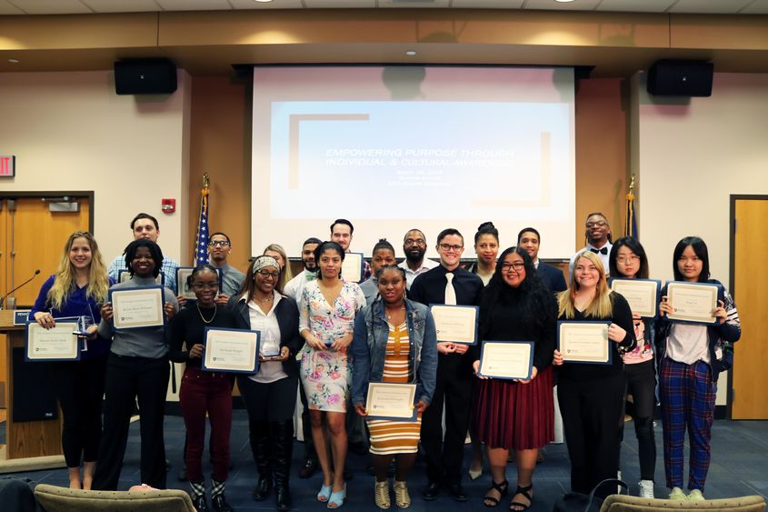 Group of Students standing holding award 