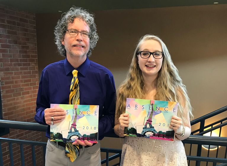 Dr. Clifford Manlove (Left) and Loren Baseler (Right) holding the 20th issue of ABSENCE