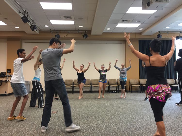 students belly dancing